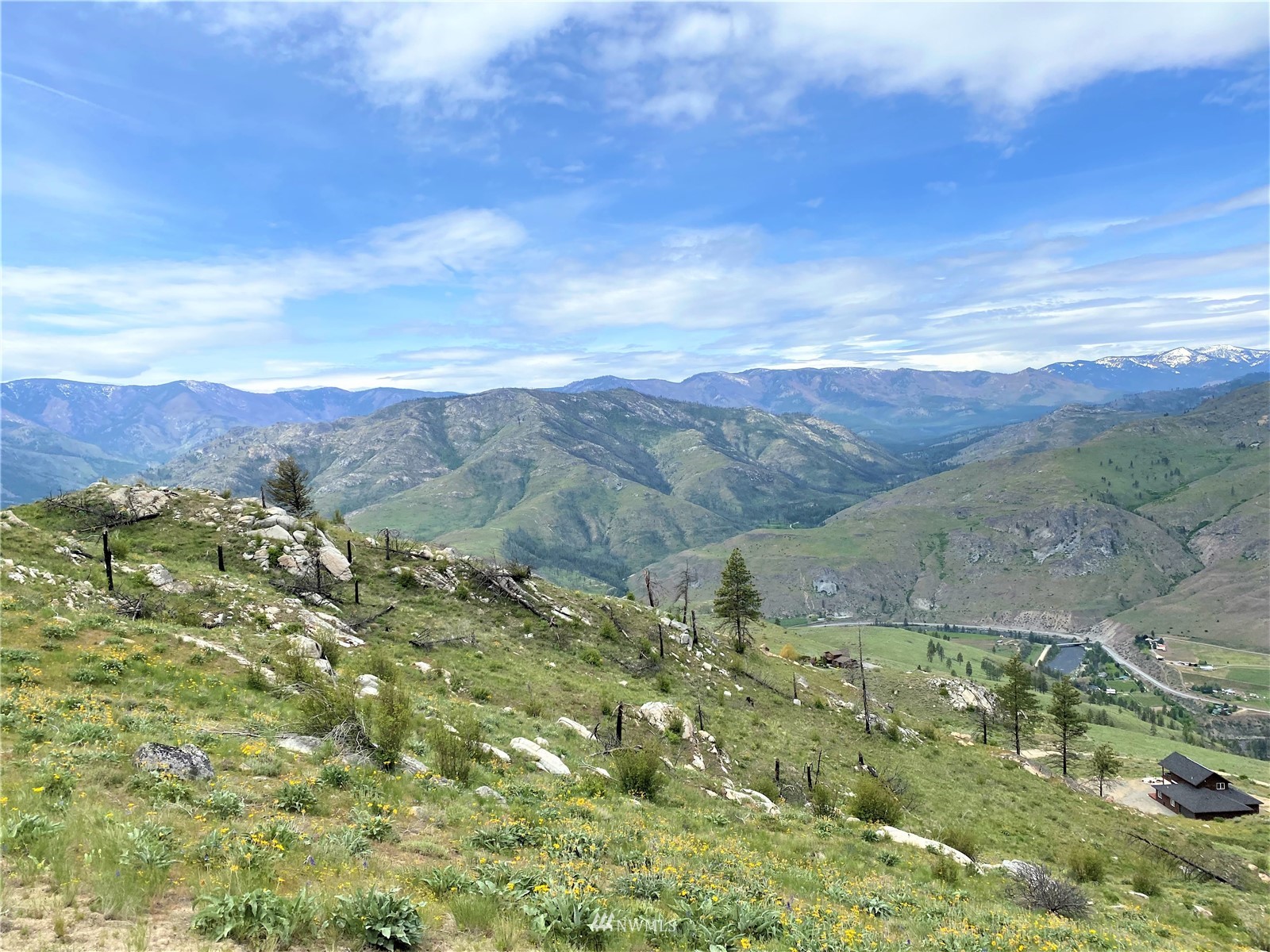 0 Sky Ridge Road Pateros, WA 98846 - Photo 17 of 39 a view of a city with mountains in the background