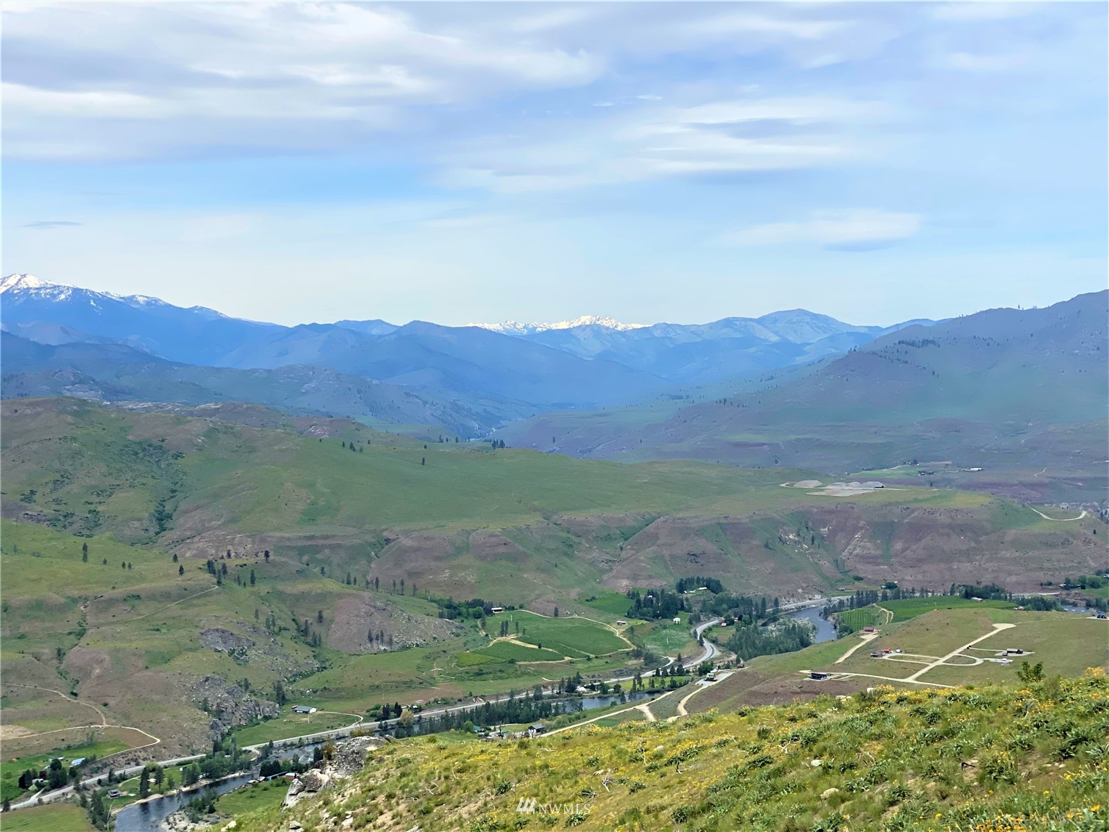 0 Sky Ridge Road Pateros, WA 98846 - Photo 19 of 39 a view of a lush green hillside and houses