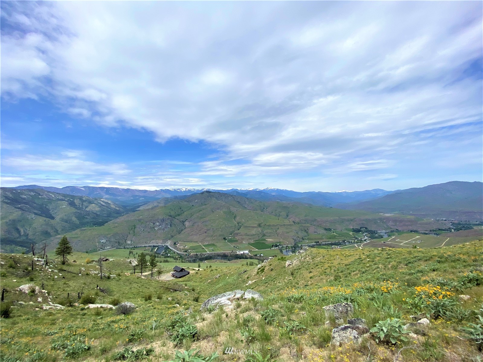 0 Sky Ridge Road Pateros, WA 98846 - Photo 24 of 39 a view of a lush green hillside and houses