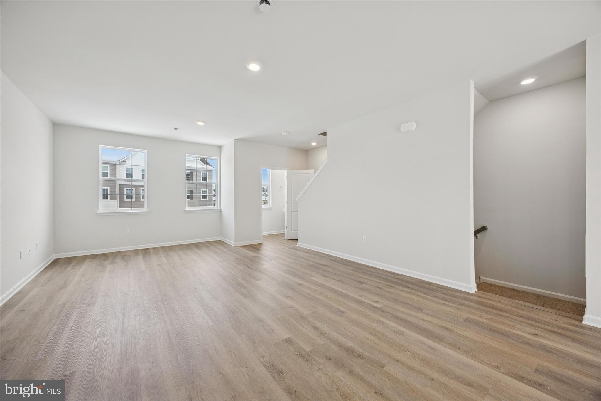 163 Sandy Rdg Road Sicklerville, NJ 08081 - Photo 14 of 30 an empty room with wooden floor and windows