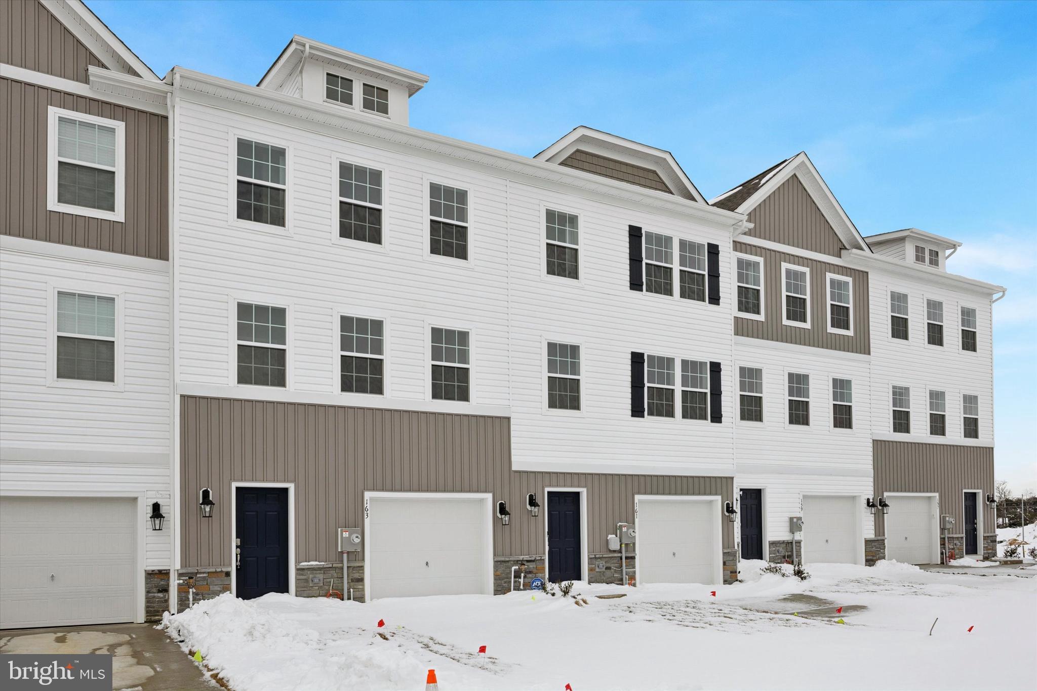 163 Sandy Rdg Road Sicklerville, NJ 08081 - Photo 7 of 30 a front view of a building with a yard