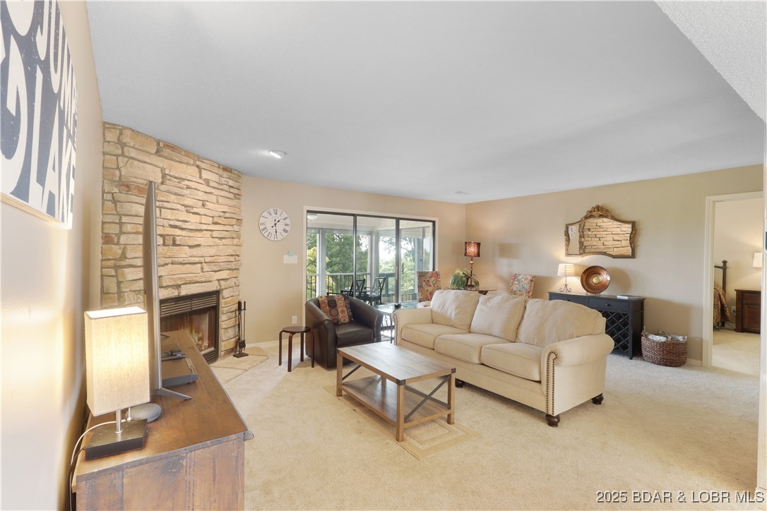 24 East Casa Del Rio, Unit 689 Lake Ozark, MO 65049 - Photo 12 of 31 Spacious living-room with wood-burning fireplace.