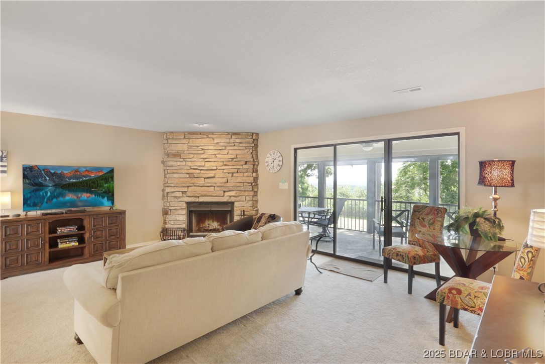 24 East Casa Del Rio, Unit 689 Lake Ozark, MO 65049 - Photo 13 of 31 Living room with nice deck area.