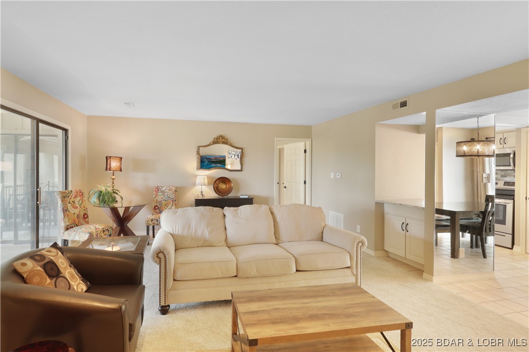 24 East Casa Del Rio, Unit 689 Lake Ozark, MO 65049 - Photo 14 of 31 View of living room & dining area.