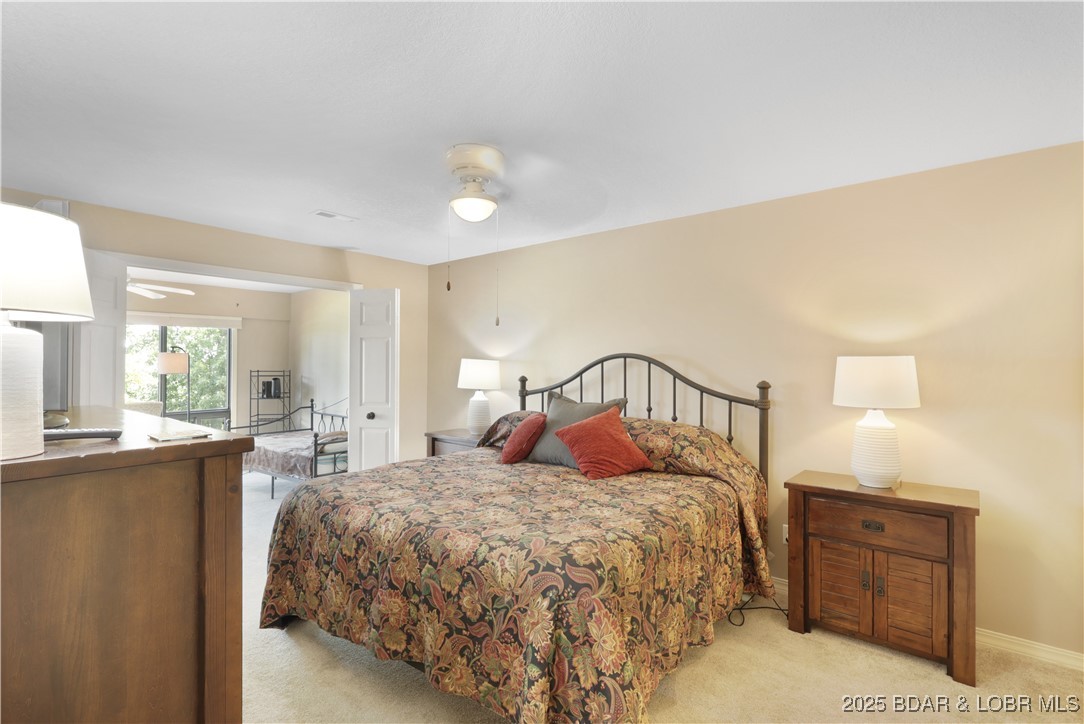 24 East Casa Del Rio, Unit 689 Lake Ozark, MO 65049 - Photo 17 of 31 Master bedroom with bonus room.