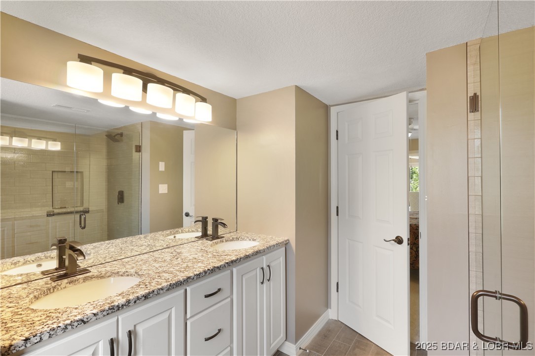 24 East Casa Del Rio, Unit 689 Lake Ozark, MO 65049 - Photo 19 of 31 Updated master bathroom.