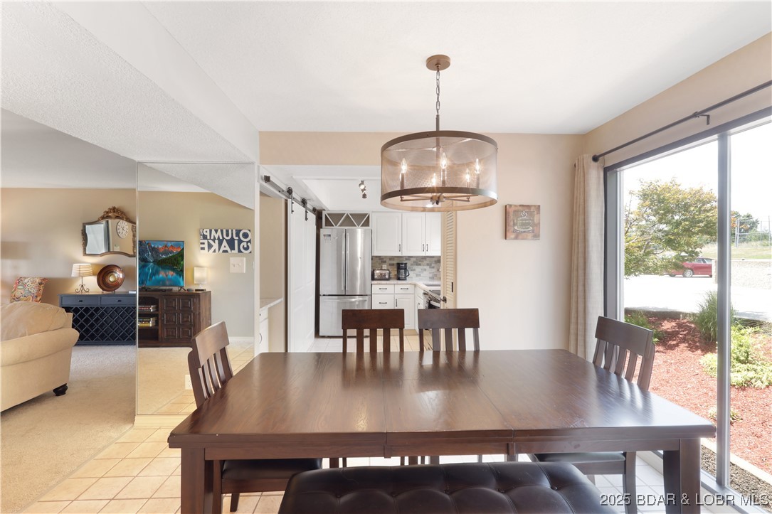 24 East Casa Del Rio, Unit 689 Lake Ozark, MO 65049 - Photo 5 of 31 Nice size dining area.