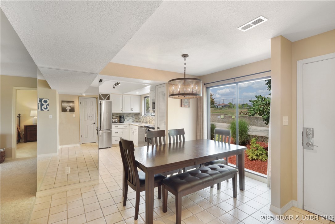 24 East Casa Del Rio, Unit 689 Lake Ozark, MO 65049 - Photo 6 of 31 Dining & Kitchen area.