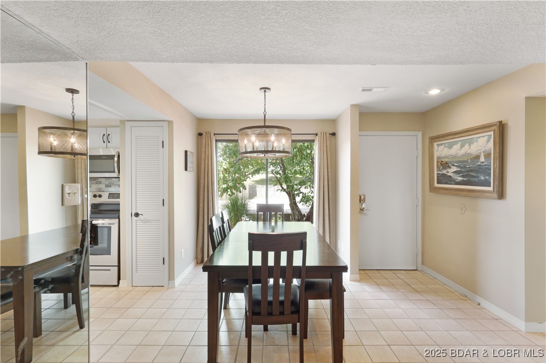 24 East Casa Del Rio, Unit 689 Lake Ozark, MO 65049 - Photo 7 of 31 Dining area located on the roadside.