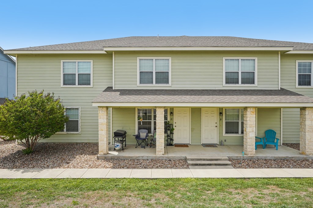 2312 Sailing Way Kerrville, TX 78028 - Photo 20 of 60 a view of a house with a backyard and windows