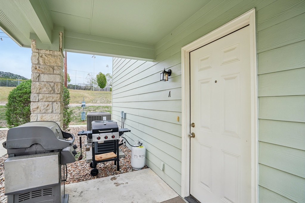 2312 Sailing Way Kerrville, TX 78028 - Photo 4 of 60 a view of balcony with chairs and a potted plant