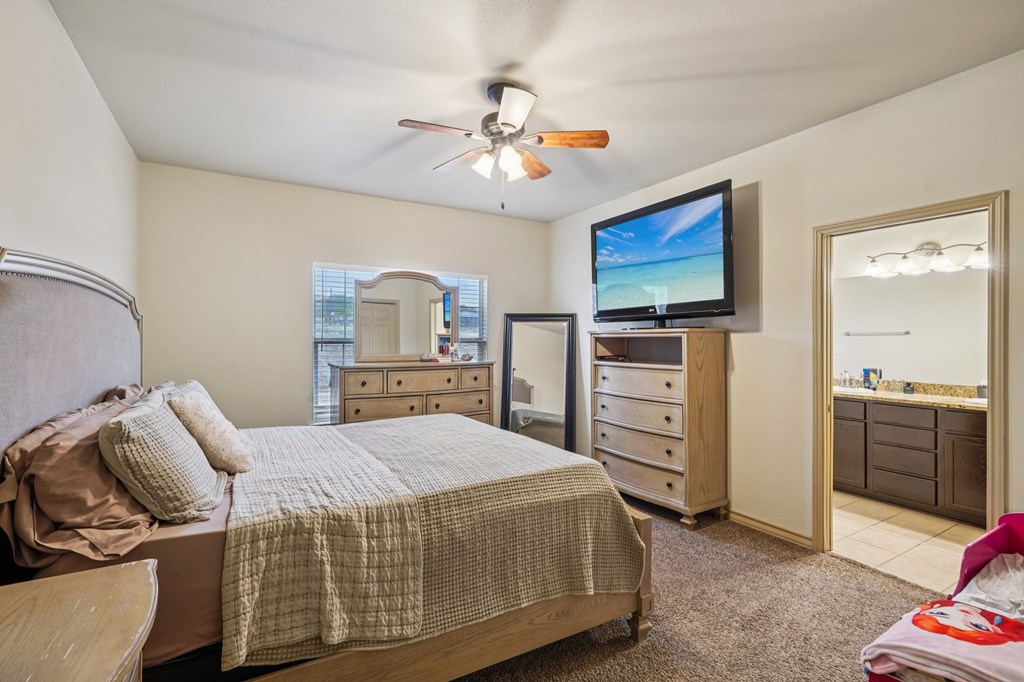 2312 Sailing Way Kerrville, TX 78028 - Photo 54 of 60 a bedroom with a bed and furniture