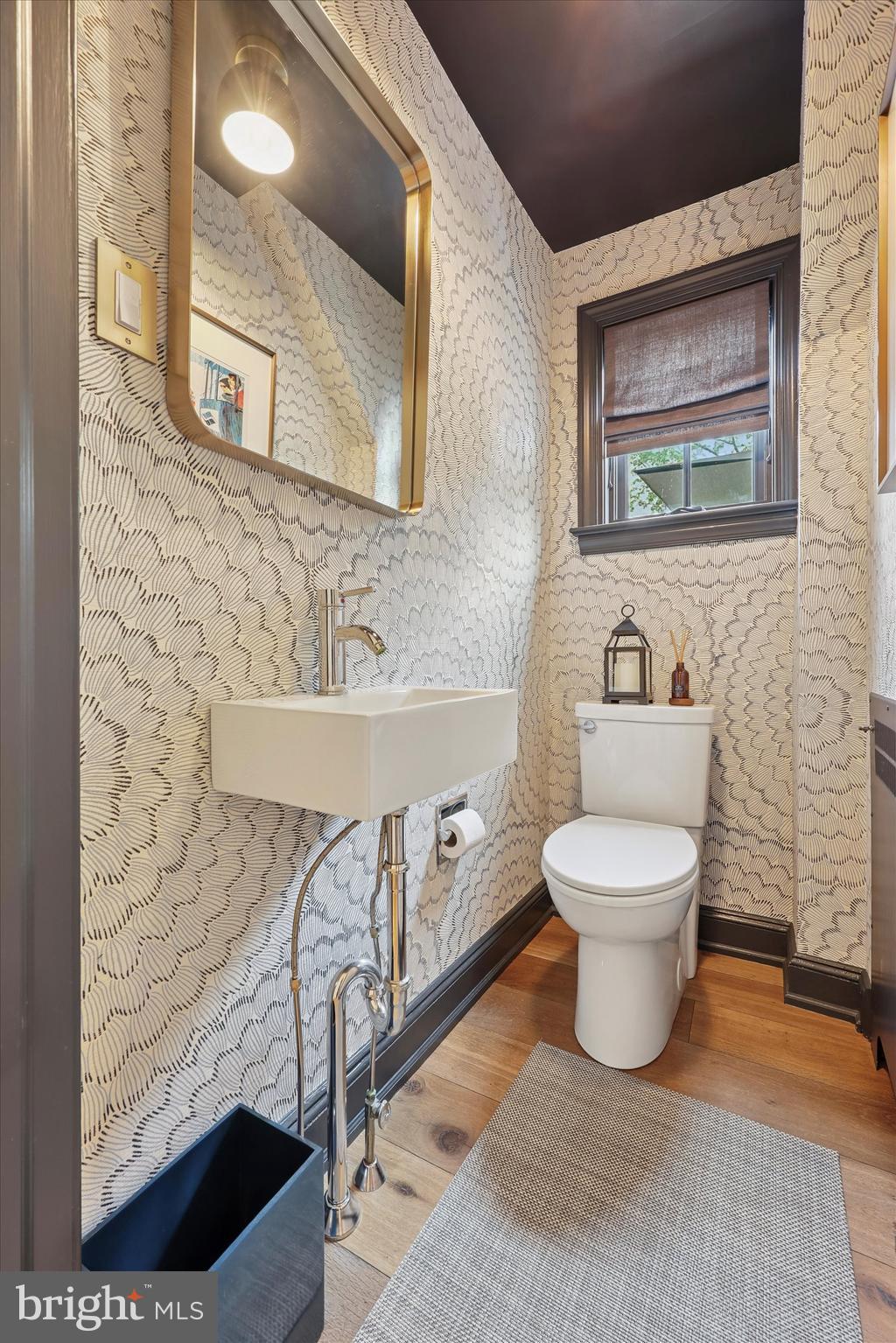 160 Rolling Road Bala Cynwyd, PA 19004 - Photo 11 of 35 a bathroom with a toilet sink and mirror