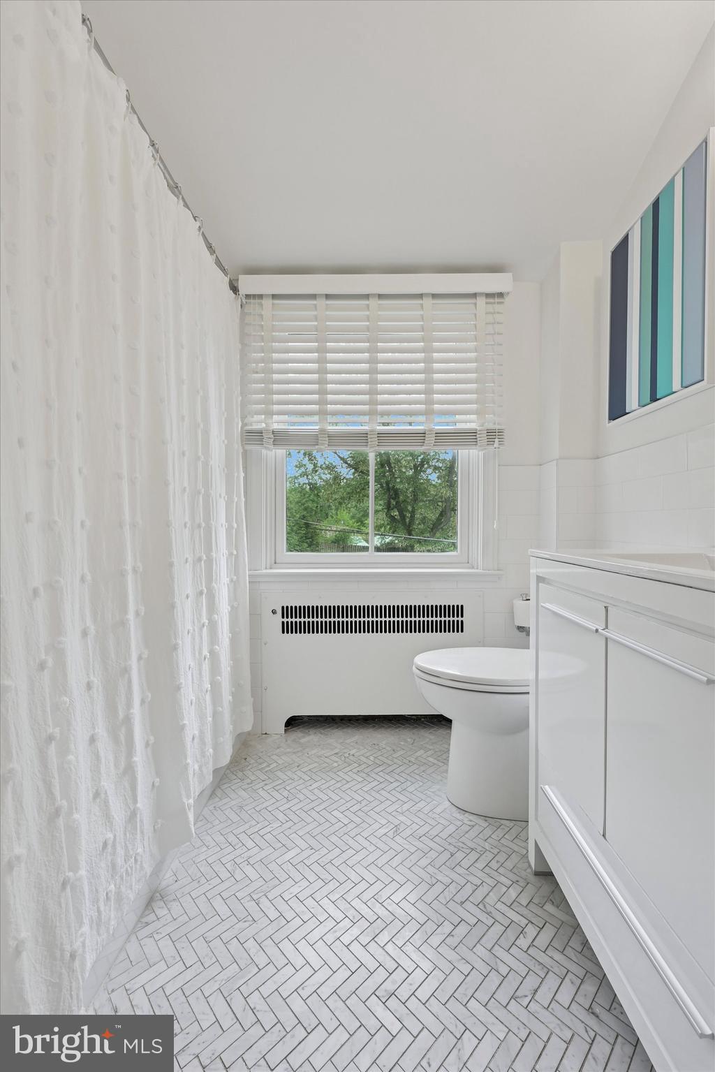 160 Rolling Road Bala Cynwyd, PA 19004 - Photo 16 of 35 a bathroom with a toilet sink and a mirror