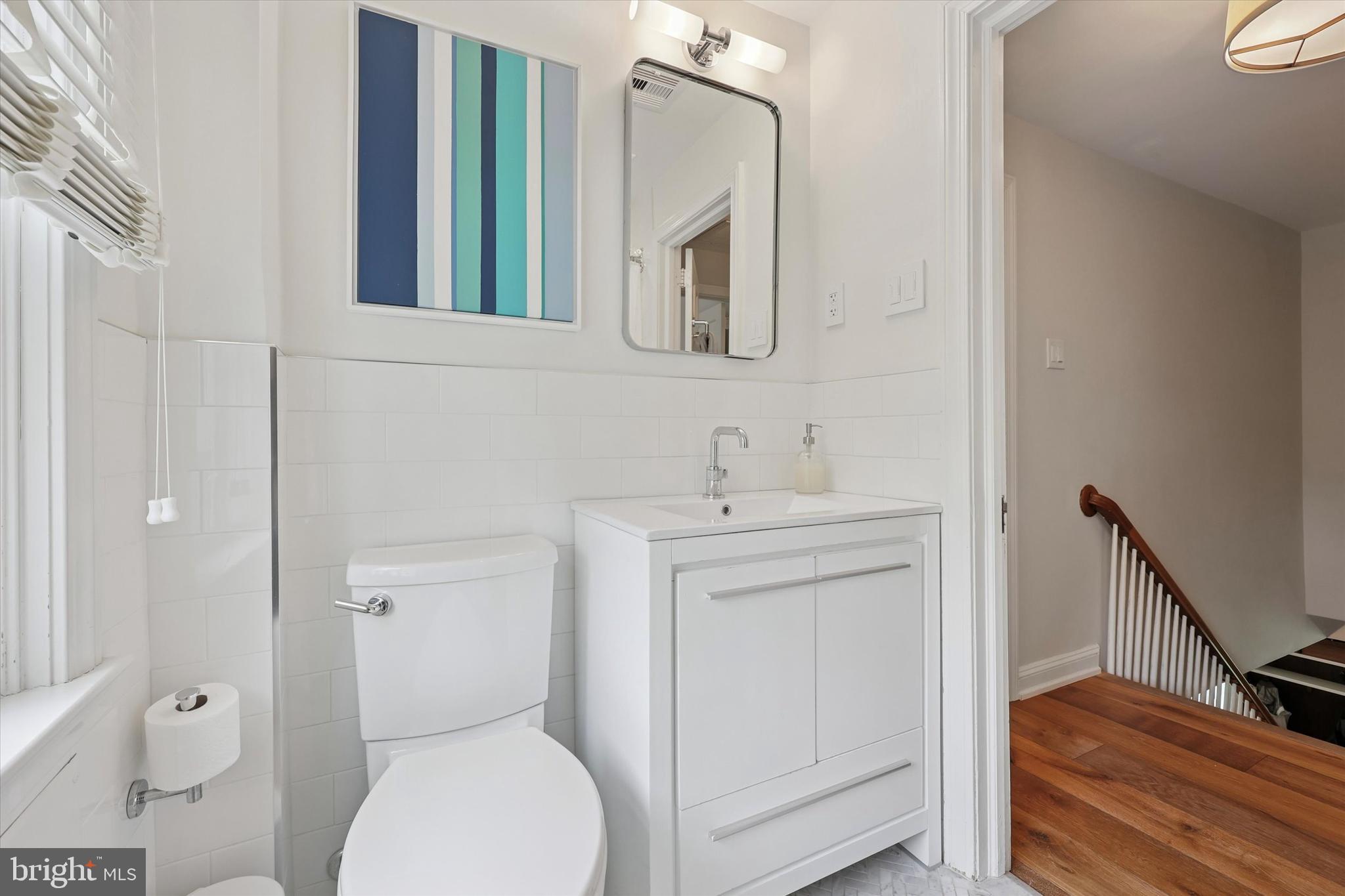 160 Rolling Road Bala Cynwyd, PA 19004 - Photo 17 of 35 a bathroom with a toilet sink and mirror