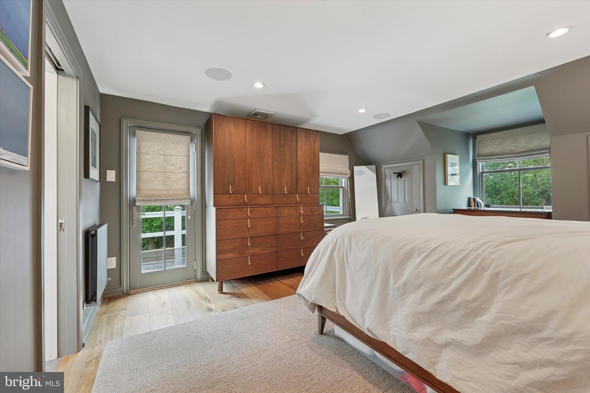 160 Rolling Road Bala Cynwyd, PA 19004 - Photo 23 of 35 a spacious bedroom with a large bed and wooden floor