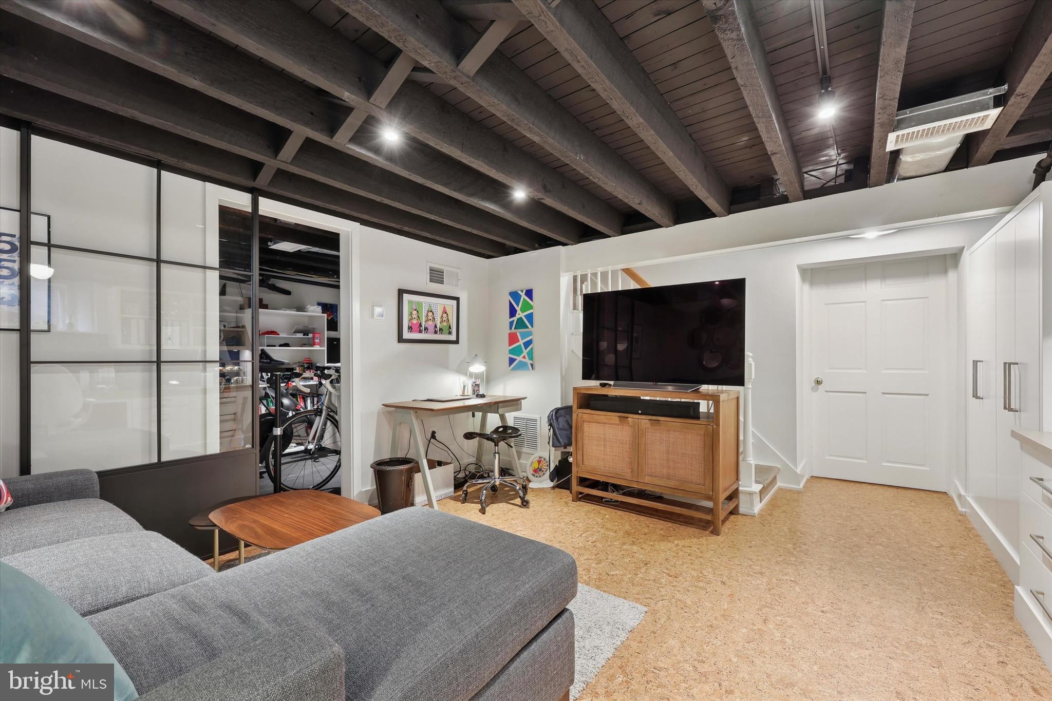 160 Rolling Road Bala Cynwyd, PA 19004 - Photo 26 of 35 a living room with furniture and a flat screen tv