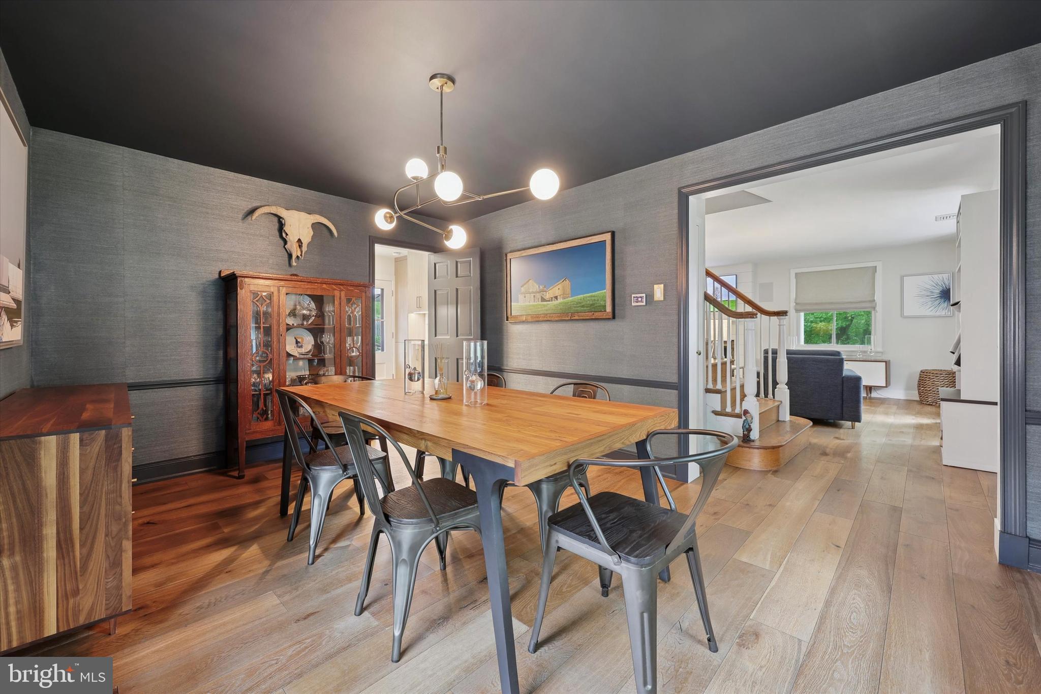 160 Rolling Road Bala Cynwyd, PA 19004 - Photo 7 of 35 a dining room with furniture a chandelier and wooden floor