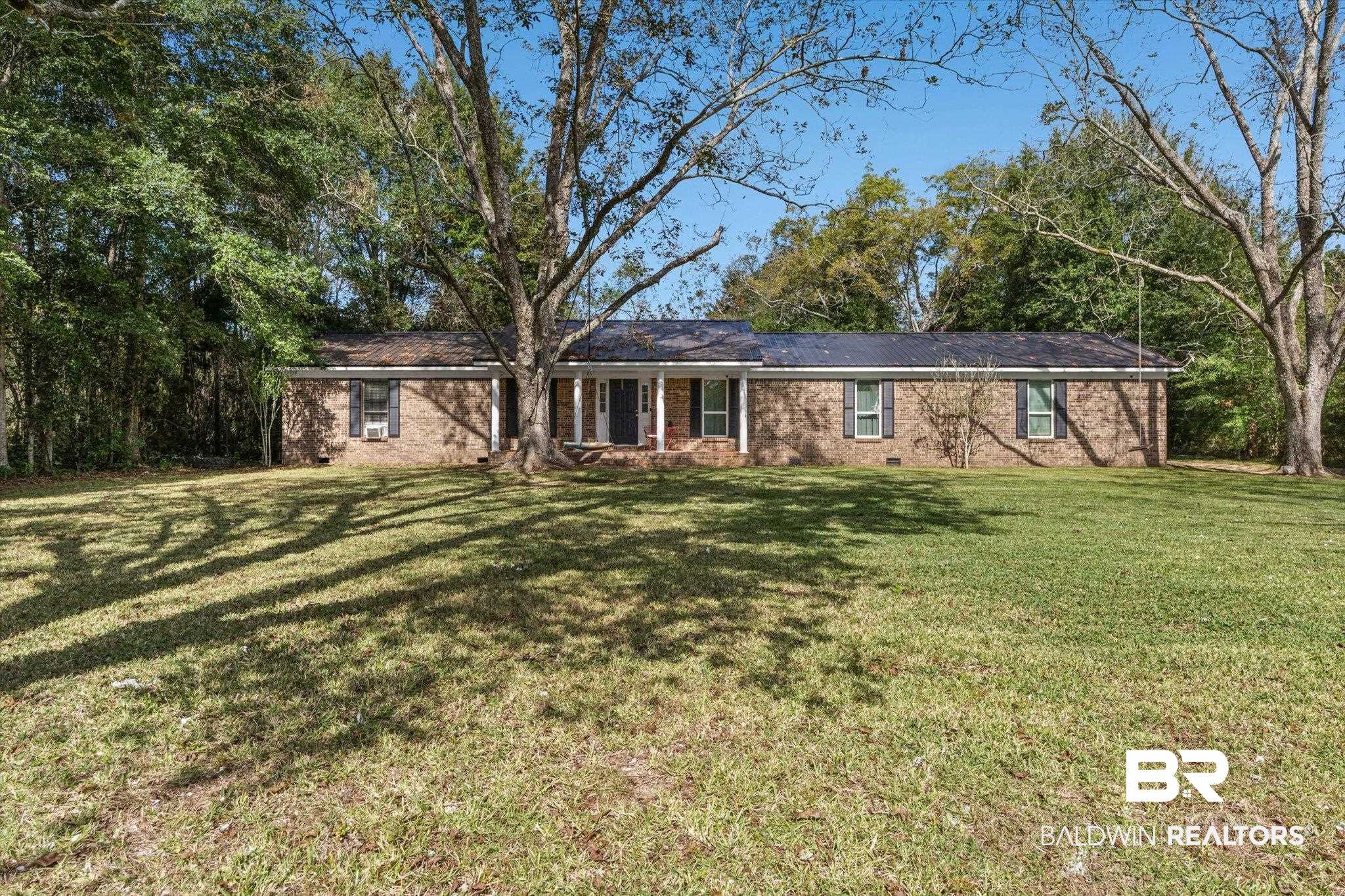 11440 Diffee Road Grand Bay, AL 36541 - Photo 2 of 22 Single story home with a front lawn, brick siding, and crawl space