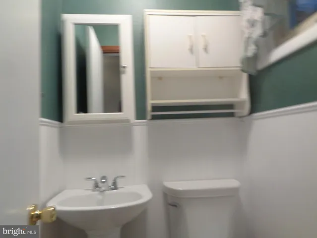 a bathroom with a sink and mirror