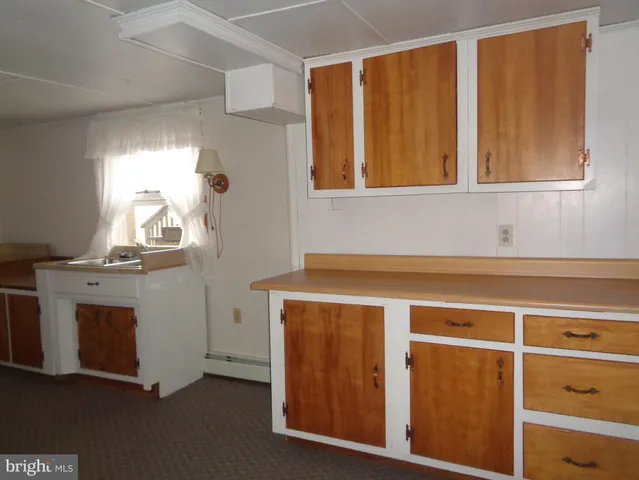 a kitchen with a stove and a cabinet