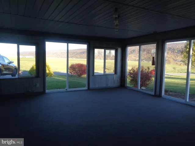 a view of a room with porch and a floor to ceiling window