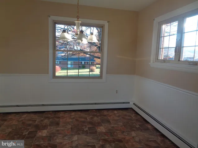 a view of a room that has a window in it