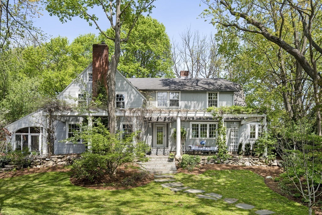 112 Bailey Road Watertown, MA 02472 - Photo 1 of 34 a view of a house with a small yard plants and large tree