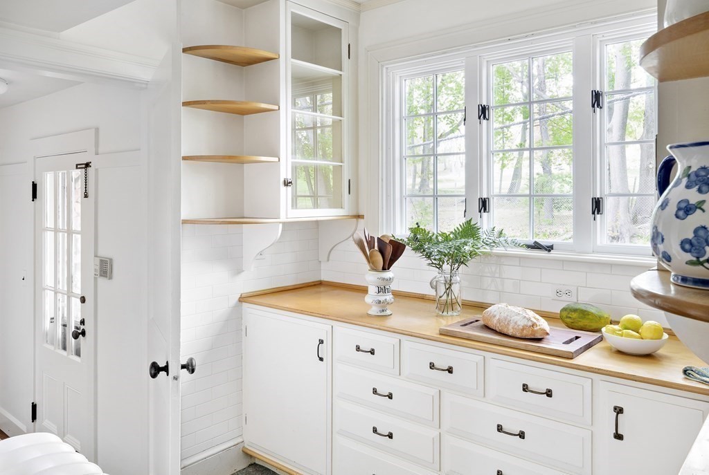 112 Bailey Road Watertown, MA 02472 - Photo 12 of 34 a bathroom with a granite countertop sink mirror vanity and next to a window