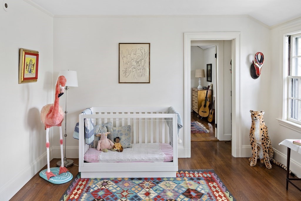 112 Bailey Road Watertown, MA 02472 - Photo 24 of 34 a bedroom with furniture and a wooden floor