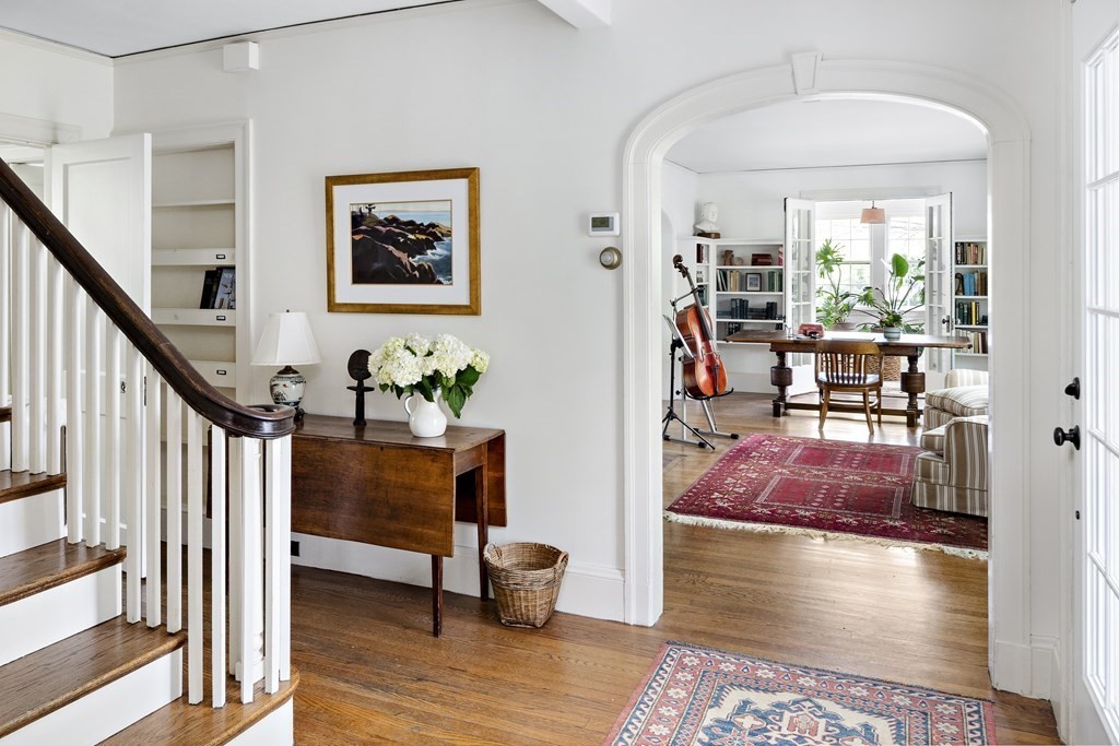 112 Bailey Road Watertown, MA 02472 - Photo 3 of 34 a view of a hallway with furniture and wooden floor