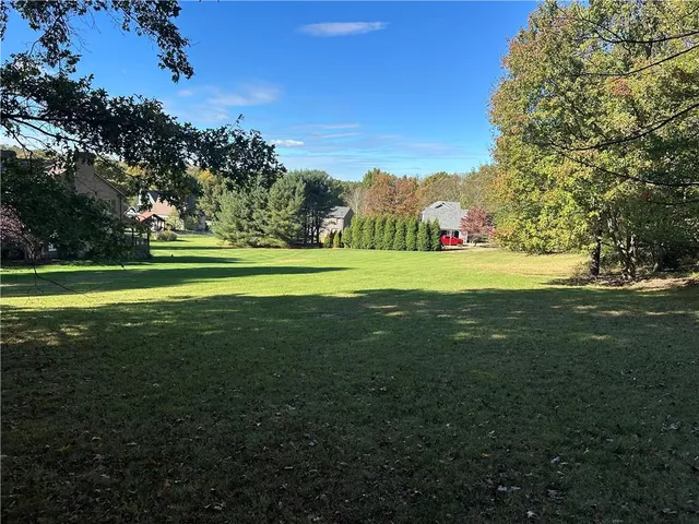 a view of a golf course with a big yard