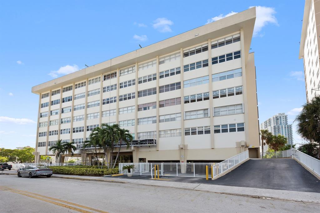 111 Golden Isles Drive, Unit B2 Hallandale Beach, FL 33009 - Photo 1 of 12 a front view of a building