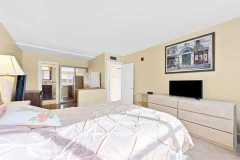 a bedroom with a large bed and a large bed