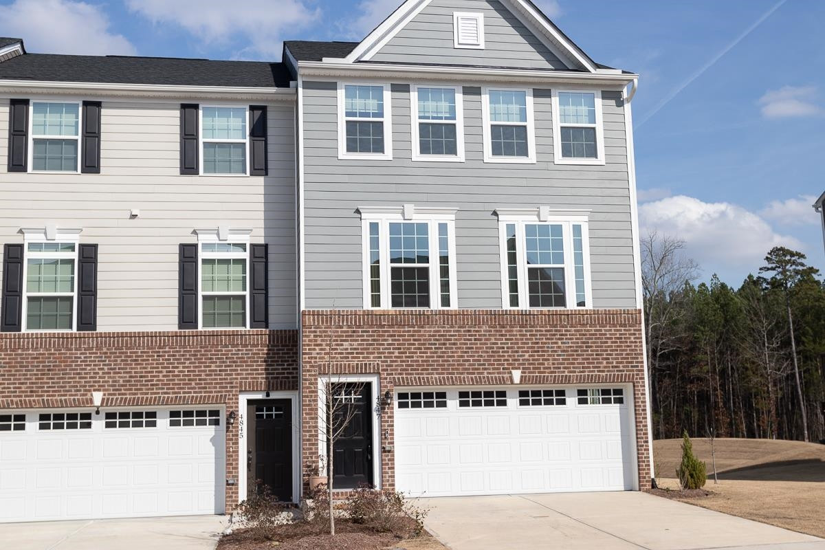 4847 Randall Road Durham, NC 27707 - Photo 1 of 25 a front view of a house with a yard