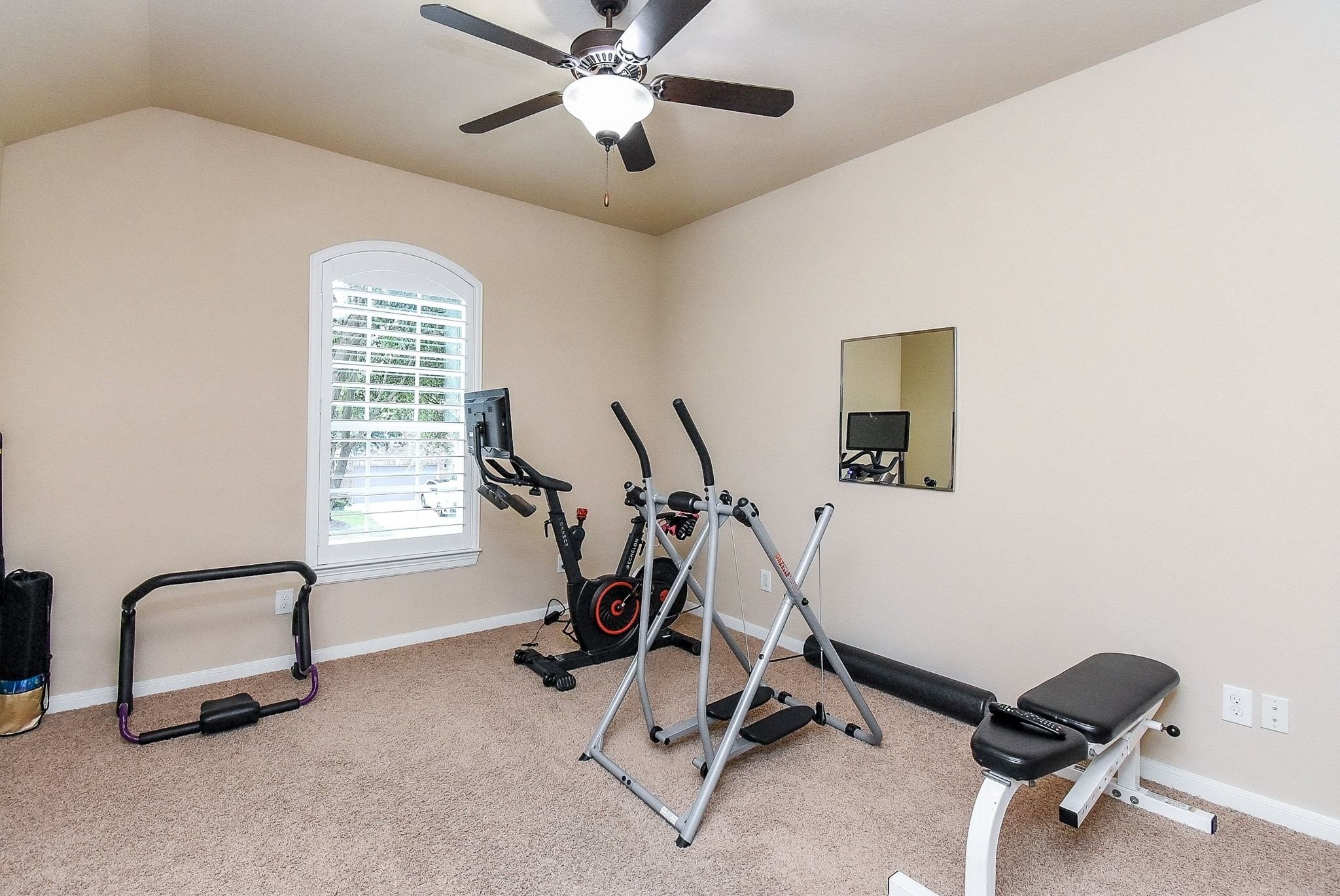27607 Macklind Ridge Lane Katy, TX 77494 - Photo 40 of 50 One of 5 secondary bedrooms upstairs. Ceiling fan and plantation shutters.
