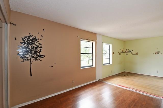 9774 Richmond Circle Boca Raton, FL 33434 - Photo 12 of 14 wooden floor in an empty room with a window