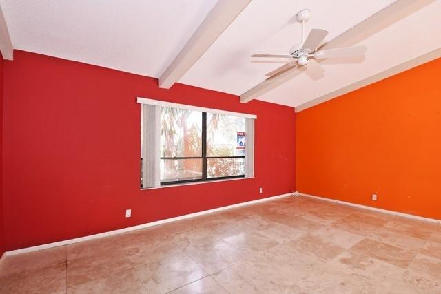 9774 Richmond Circle Boca Raton, FL 33434 - Photo 2 of 14 an empty room with windows and fan
