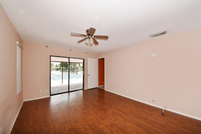 9774 Richmond Circle Boca Raton, FL 33434 - Photo 8 of 14 a view of an empty room with wooden floor and a window