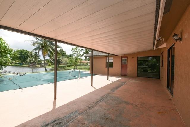 9774 Richmond Circle Boca Raton, FL 33434 - Photo 9 of 14 a view of a house with backyard and porch
