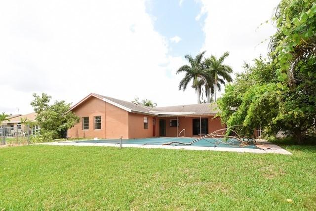 9774 Richmond Circle Boca Raton, FL 33434 - Photo 10 of 14 a front view of a house with a yard