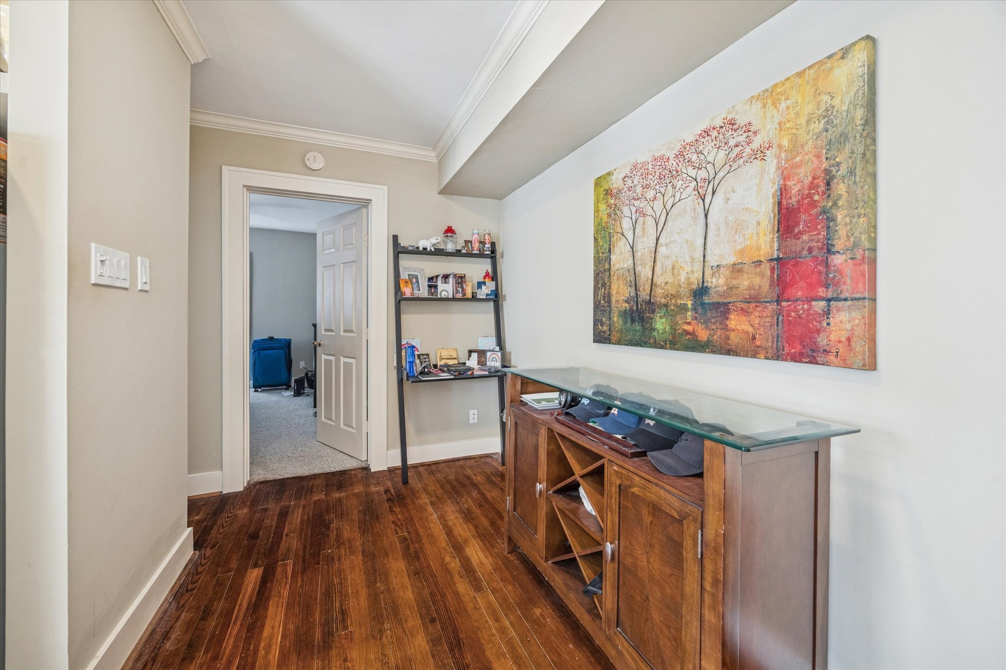 3711 Reagan Street Houston, TX 77009 - Photo 11 of 40 a view of a hallway with wooden floor and furniture