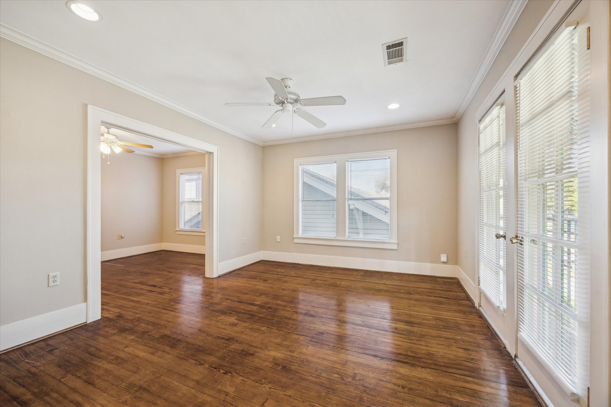3711 Reagan Street Houston, TX 77009 - Photo 13 of 40 a view of an empty room with wooden floor and a window