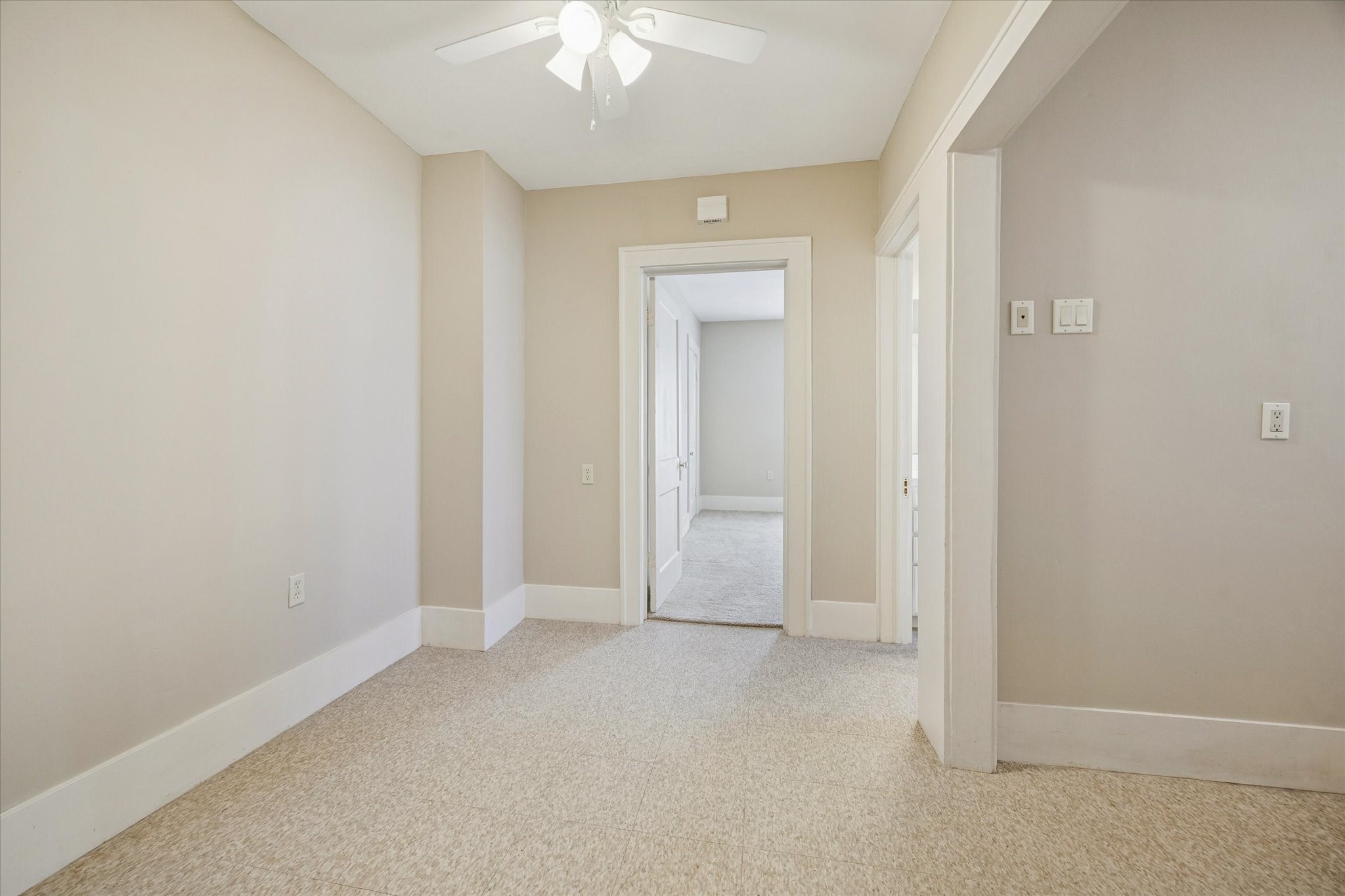 3711 Reagan Street Houston, TX 77009 - Photo 18 of 40 an empty room with a fan and a chandelier fan