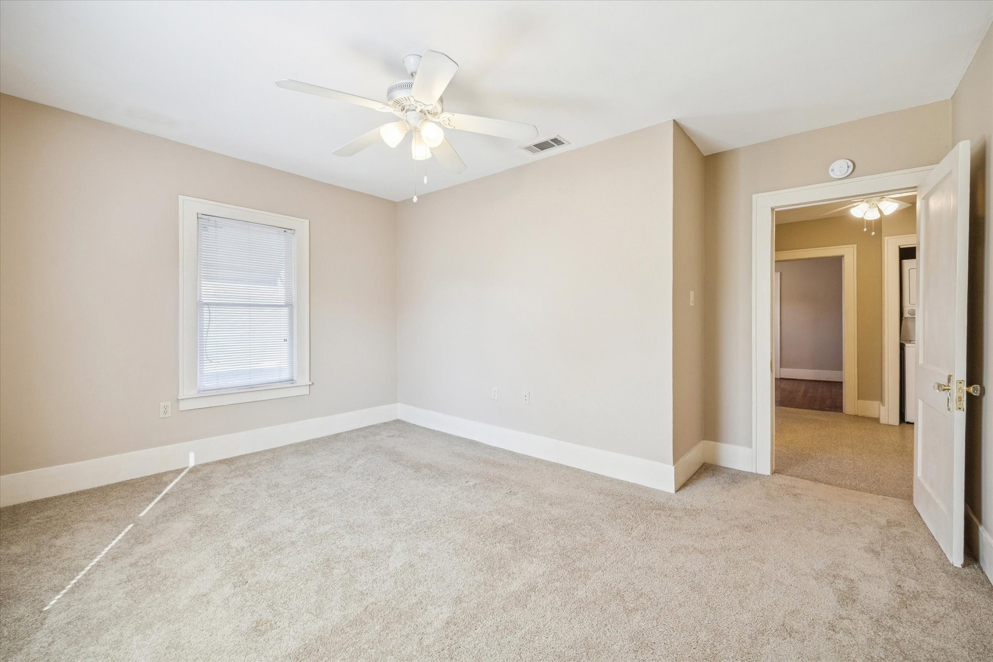 3711 Reagan Street Houston, TX 77009 - Photo 22 of 40 a view of an empty room with a window