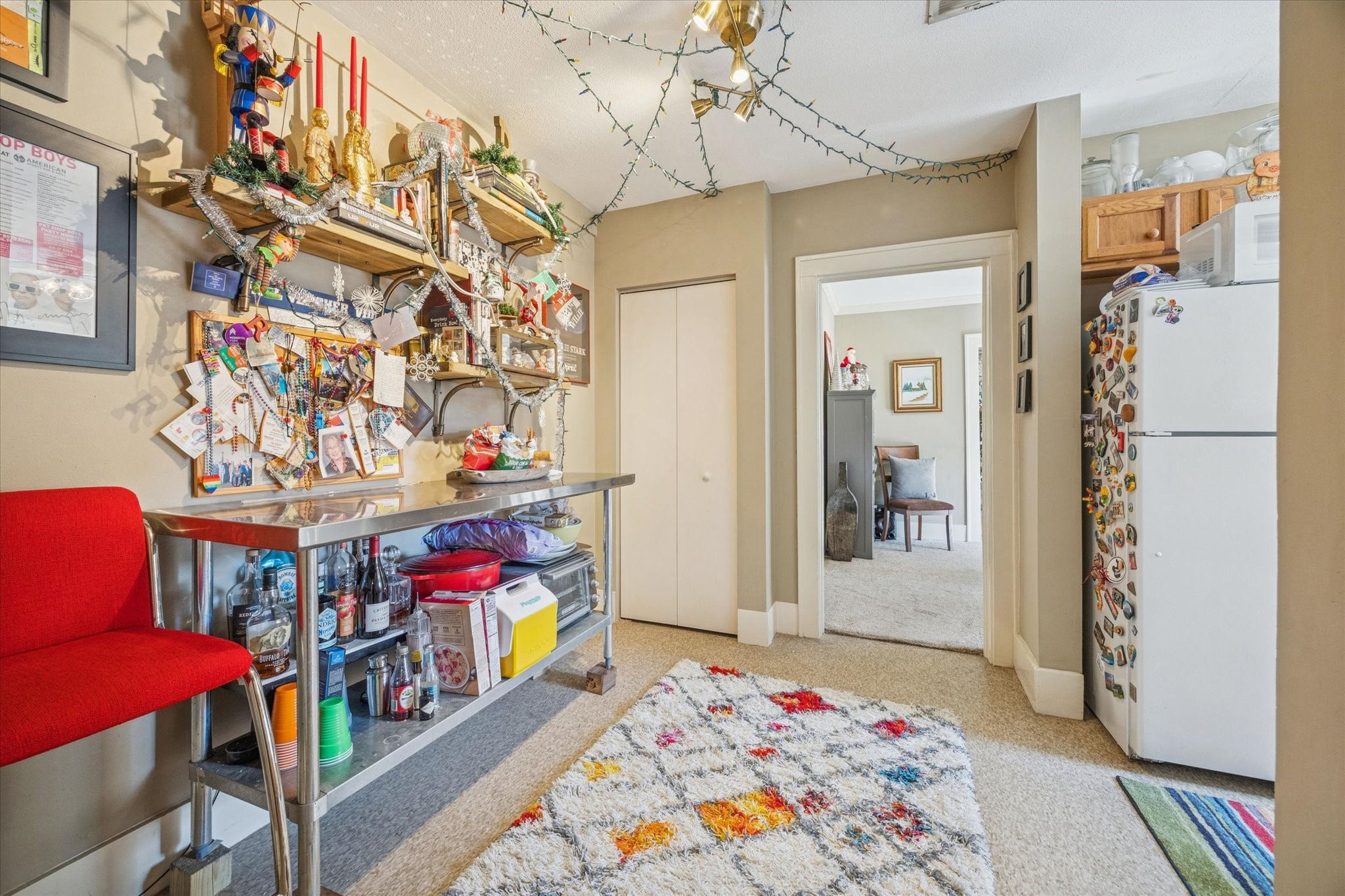 3711 Reagan Street Houston, TX 77009 - Photo 27 of 40 a bedroom with a bed and a chandelier