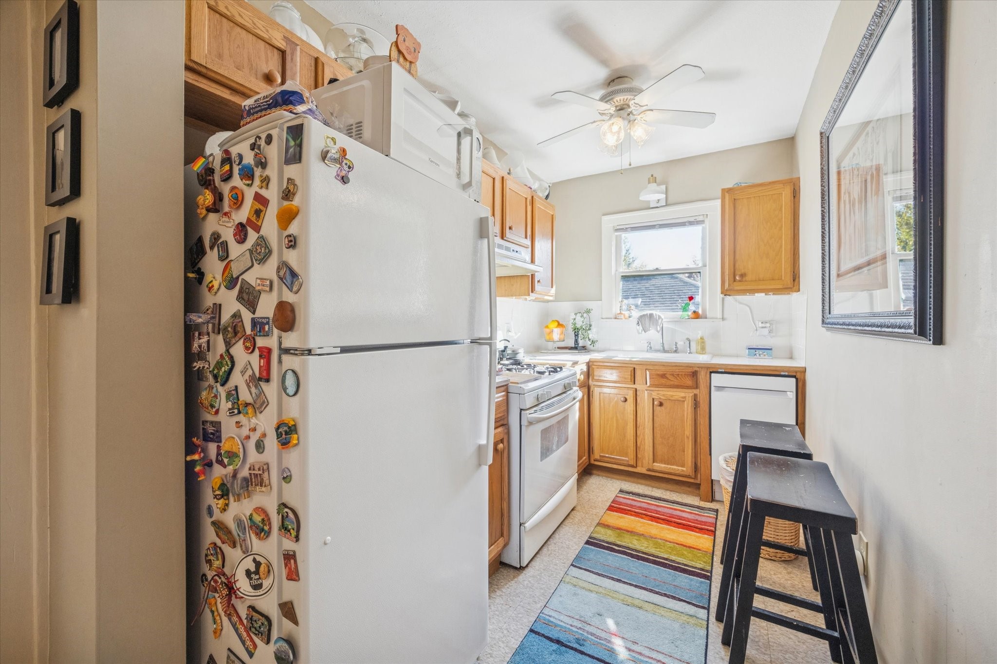 3711 Reagan Street Houston, TX 77009 - Photo 29 of 40 a kitchen with a refrigerator and a sink