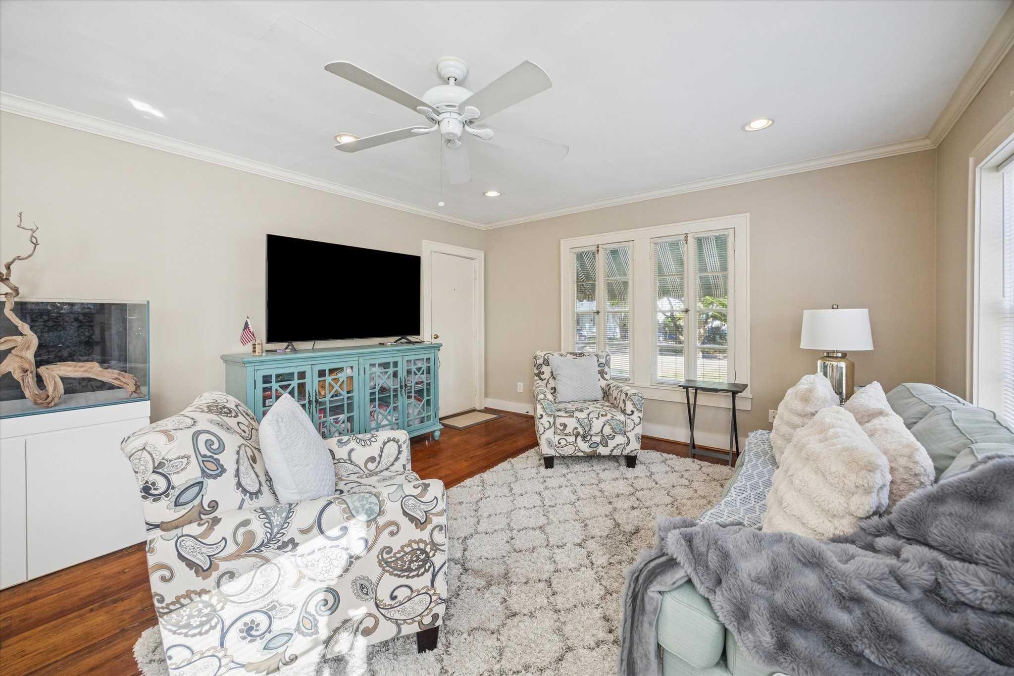 3711 Reagan Street Houston, TX 77009 - Photo 8 of 40 a living room with furniture and a flat screen tv