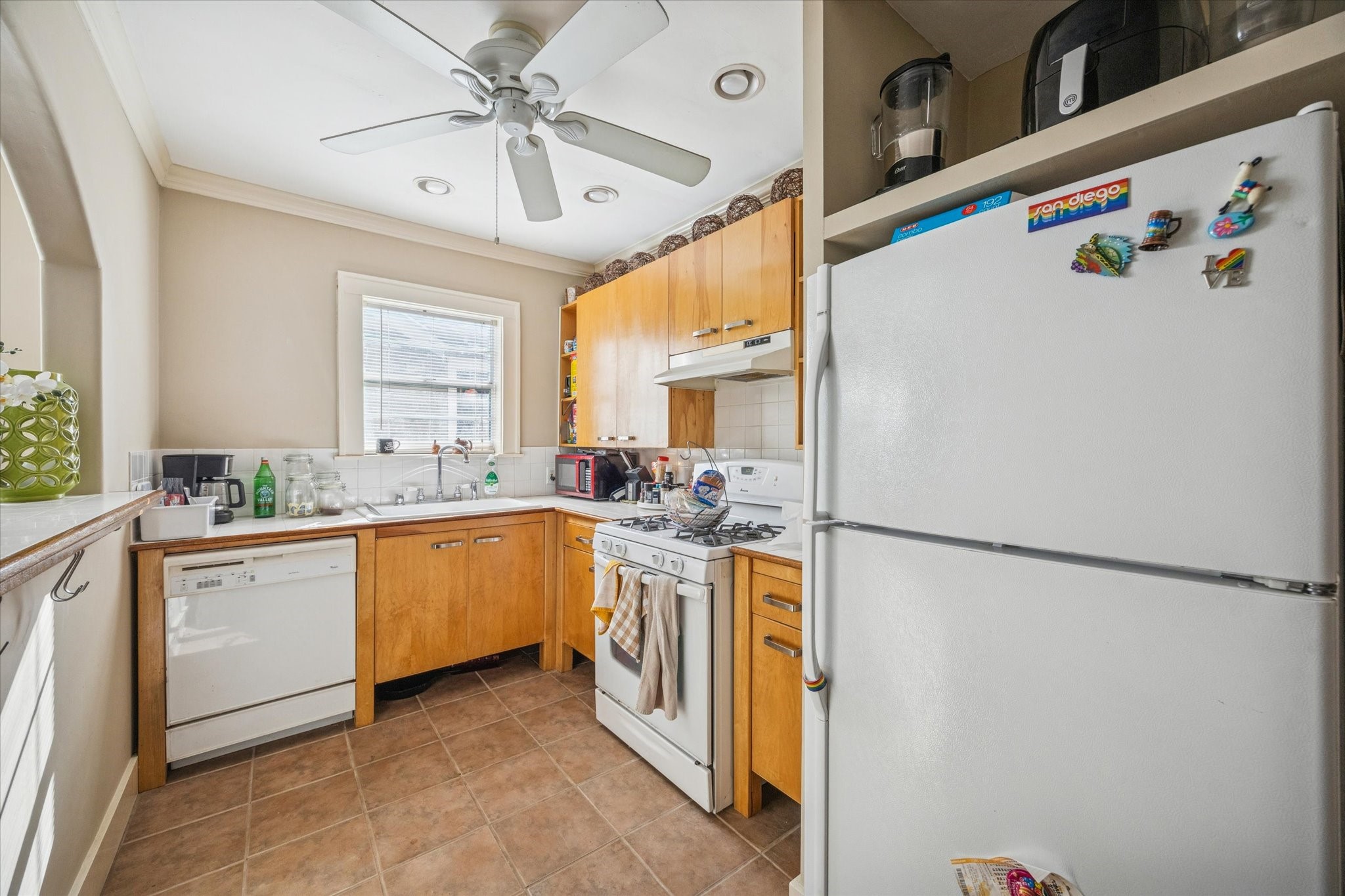 3711 Reagan Street Houston, TX 77009 - Photo 10 of 40 a kitchen with appliances a sink and a refrigerator