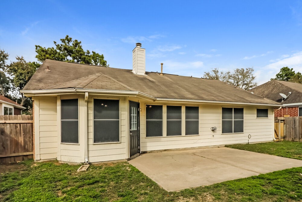 19823 Indian Cherry Forest Lane Cypress, TX 77433 - Photo 16 of 16 a view of a house with a small yard and plants